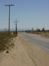 Offset telephone poles, Landers area of Mojave Desert
